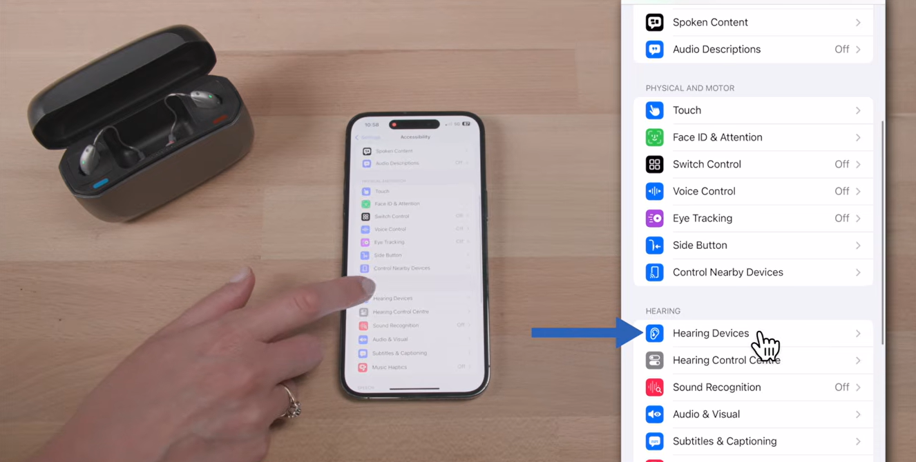 a hand pointing at a phone