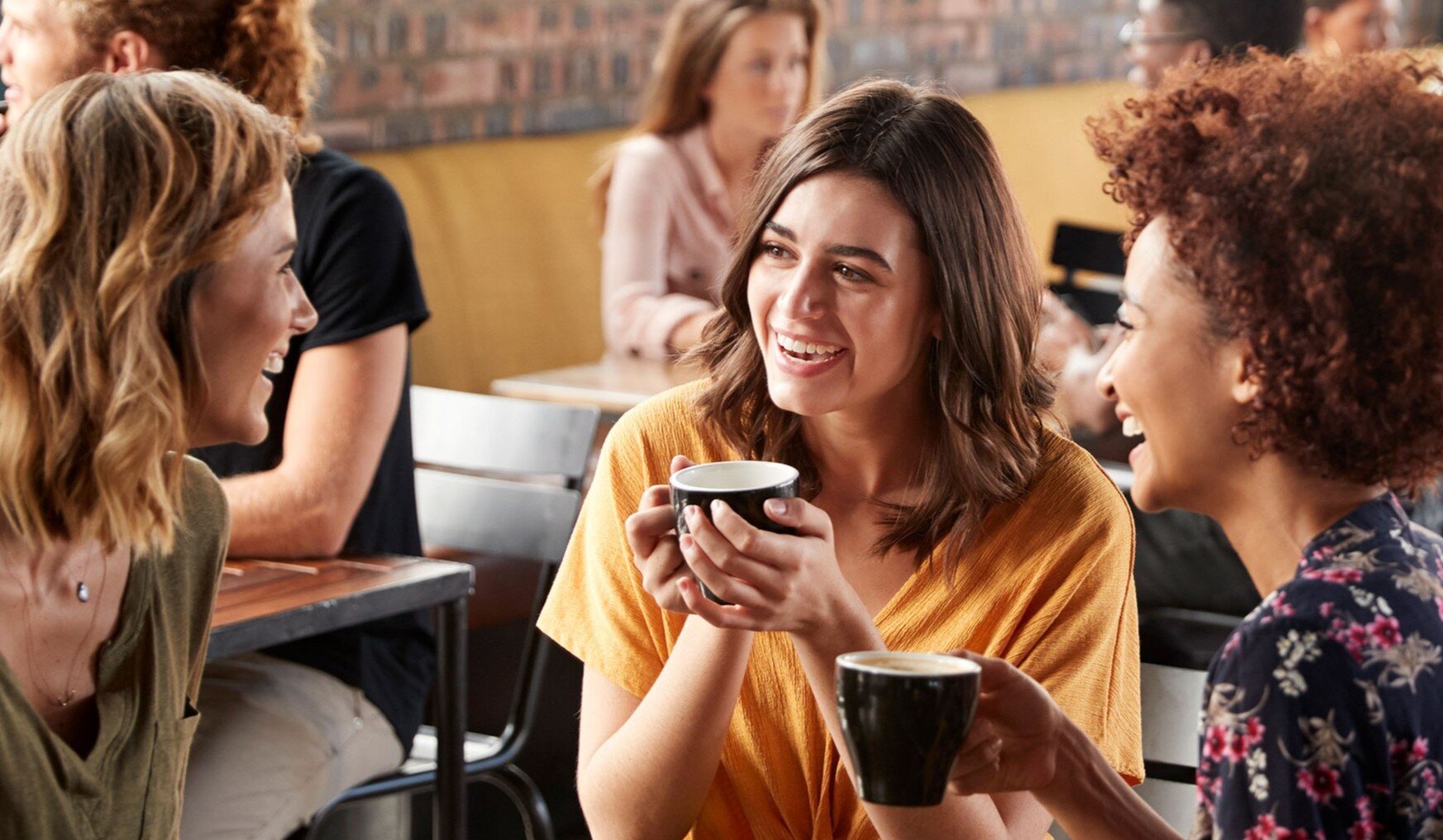 a group of women sitting at a table