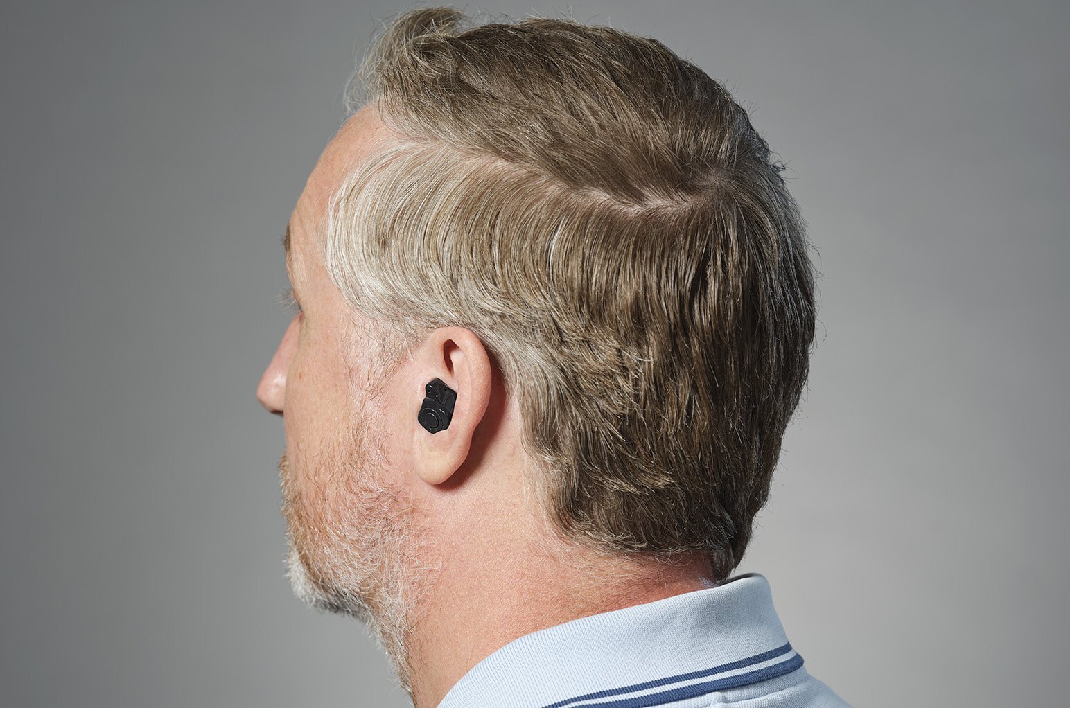  a man with an in the canal hearing aid