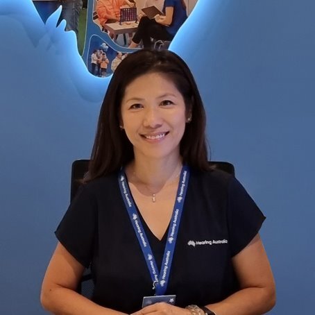 Irene, Customer Service Officer, smiling warmly and friendly at the Hearing Australia centre