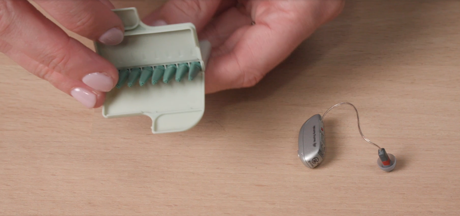 a hand holding a small device