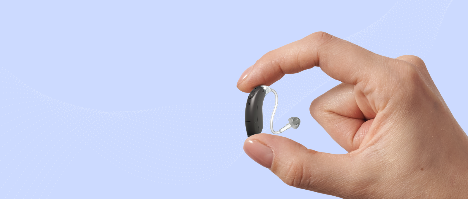 a person holding a hearing aid