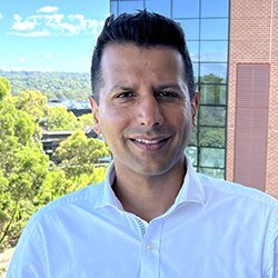 Sandeep, Head of Applications at Hearing Australia, smiling warmly